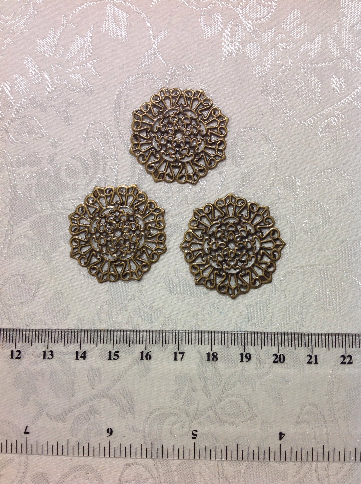 Metal stampings, circle (4/0204)