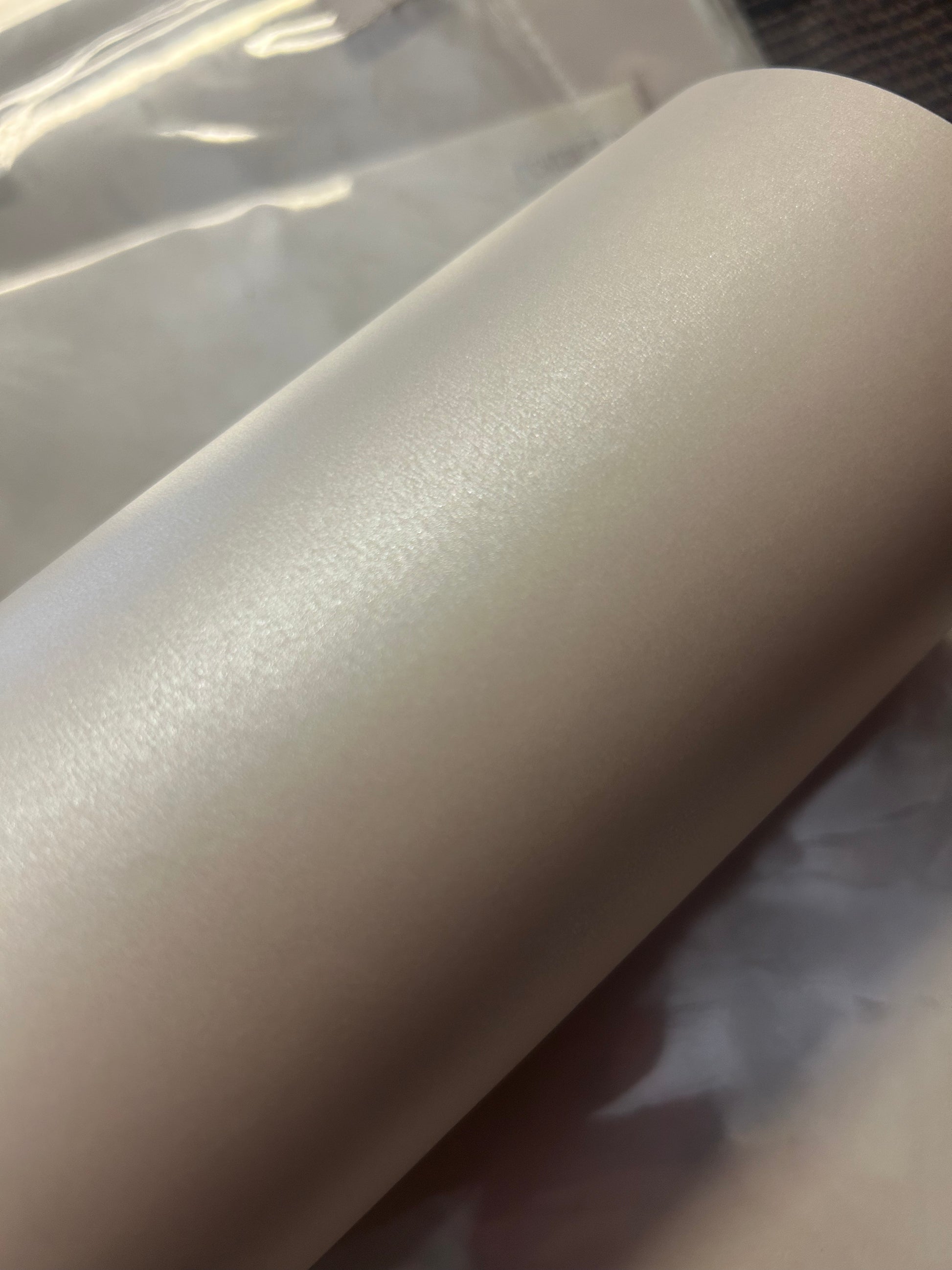 A stack of shimmer white 100gsm vellum A4 paper with a pearly shimmer, intended for use in invitations and card projects.
