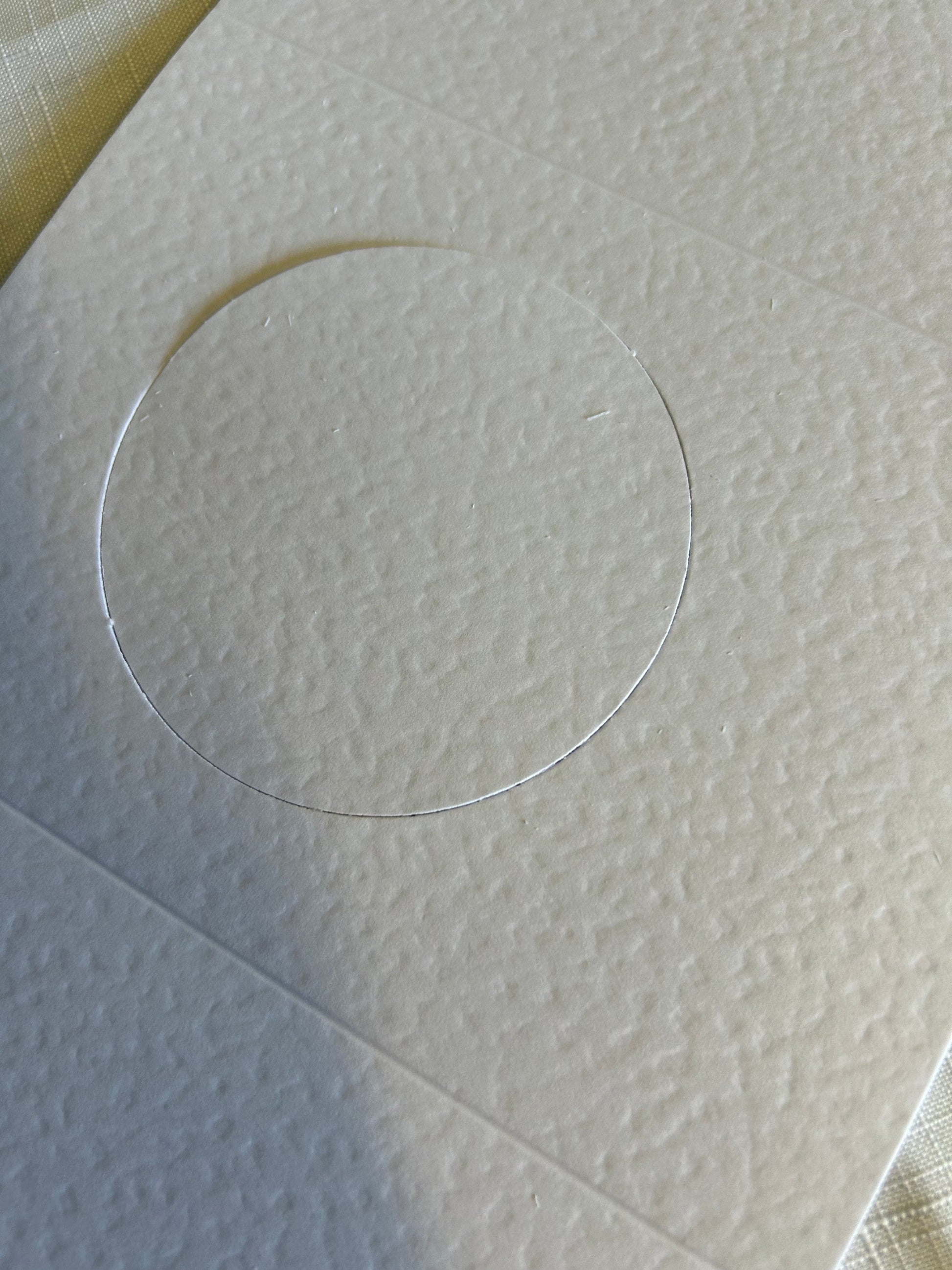 3 panel card with circle cut out, lightly textured