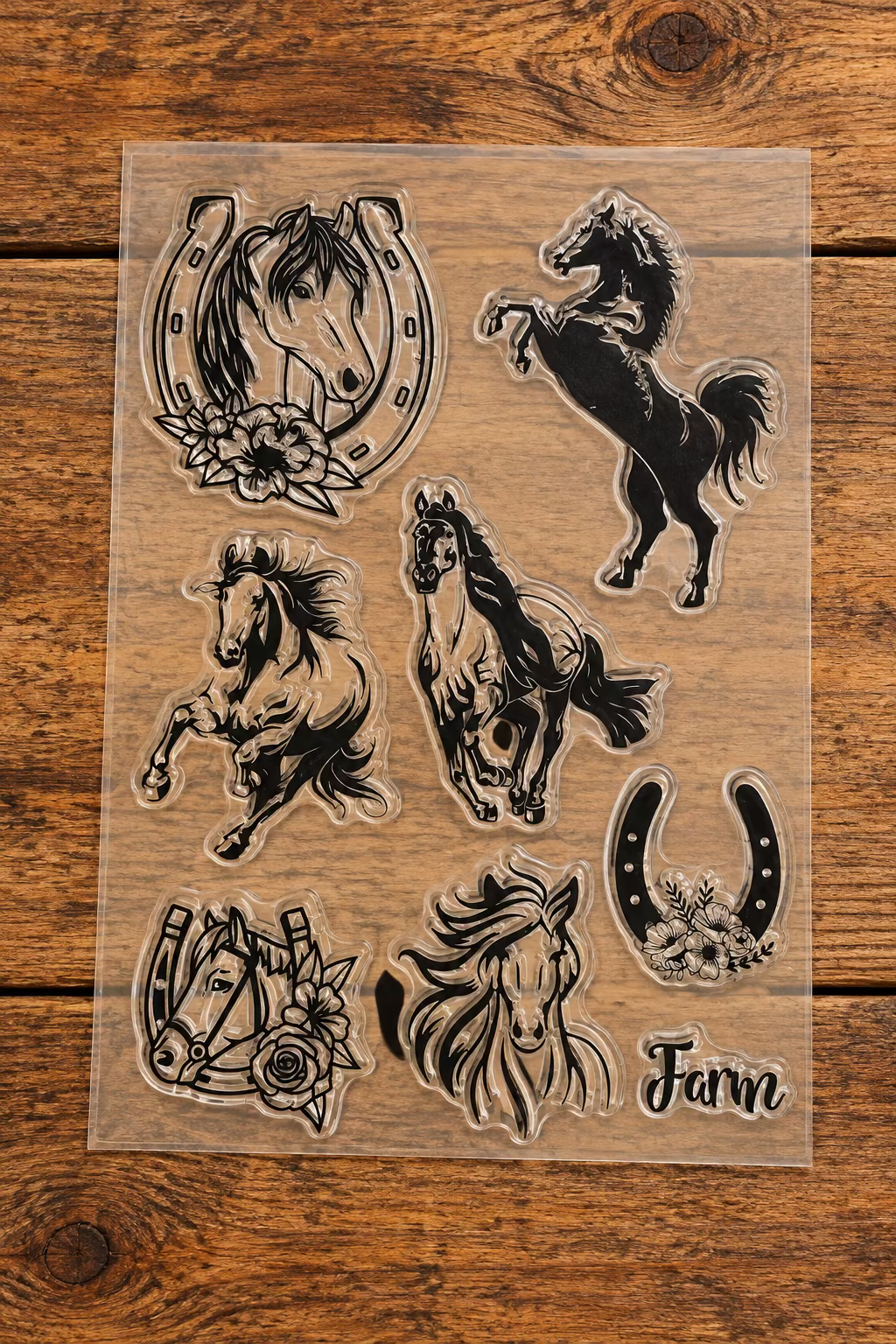 A sheet of clear acrylic or rubber stamps featuring multiple horse-themed designs, including horses, horseshoes, floral accents, and the word 'Farm'